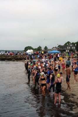 Triathlon 2009
Over two hundred athletes participated in this year's Mattapoisett Triathlon on Sunday morning, July 12. The athletes endurance was tested over a course which included a quarter-mile swim, a ten-mile bike ride and a three and three quarters-mile run. The race marks the beginning of the Mattapoisett Lions Club's annual Harbor Days Celebration with events including a craft fair, several suppers and a pancake breakfast , which unfold over the course of the week. Photo by Robert Chiarito.
