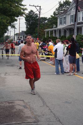 Triathlon 2009
Over two hundred athletes participated in this year's Mattapoisett Triathlon on Sunday morning, July 12. The athletes endurance was tested over a course which included a quarter-mile swim, a ten-mile bike ride and a three and three quarters-mile run. The race marks the beginning of the Mattapoisett Lions Club's annual Harbor Days Celebration with events including a craft fair, several suppers and a pancake breakfast , which unfold over the course of the week. Photo by Robert Chiarito.
