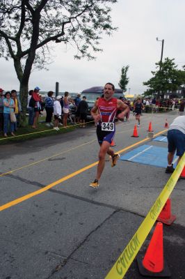 Triathlon 2009
Over two hundred athletes participated in this year's Mattapoisett Triathlon on Sunday morning, July 12. The athletes endurance was tested over a course which included a quarter-mile swim, a ten-mile bike ride and a three and three quarters-mile run. The race marks the beginning of the Mattapoisett Lions Club's annual Harbor Days Celebration with events including a craft fair, several suppers and a pancake breakfast , which unfold over the course of the week. Photo by Robert Chiarito.
