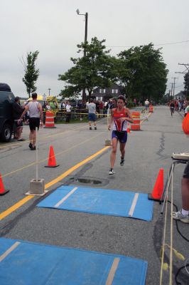 Triathlon 2009
Over two hundred athletes participated in this year's Mattapoisett Triathlon on Sunday morning, July 12. The athletes endurance was tested over a course which included a quarter-mile swim, a ten-mile bike ride and a three and three quarters-mile run. The race marks the beginning of the Mattapoisett Lions Club's annual Harbor Days Celebration with events including a craft fair, several suppers and a pancake breakfast , which unfold over the course of the week. Photo by Robert Chiarito.
