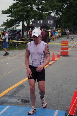 Triathlon 2009
Over two hundred athletes participated in this year's Mattapoisett Triathlon on Sunday morning, July 12. The athletes endurance was tested over a course which included a quarter-mile swim, a ten-mile bike ride and a three and three quarters-mile run. The race marks the beginning of the Mattapoisett Lions Club's annual Harbor Days Celebration with events including a craft fair, several suppers and a pancake breakfast , which unfold over the course of the week. Photo by Robert Chiarito.
