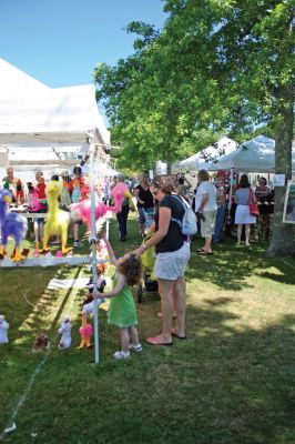 Harbor Days
The Mattapoisett Lions Club's Harbor Days Celebration 2009 wrapped up on Sunday, July 19 after a week of dining adventures, live entertainment and craft fair fun. Thousands of visitors flocked to the Mattapoisett waterfront for this annual event now in its twenty sixth year. Proceeds from the celebration help to fund many of the Club's charitable endeavors, including the Massachusetts Lions Eye Research Fund. Photo by Robert Chiarito
