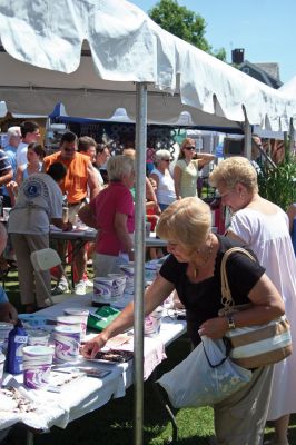 Harbor Days
The Mattapoisett Lions Club's Harbor Days Celebration 2009 wrapped up on Sunday, July 19 after a week of dining adventures, live entertainment and craft fair fun. Thousands of visitors flocked to the Mattapoisett waterfront for this annual event now in its twenty sixth year. Proceeds from the celebration help to fund many of the Club's charitable endeavors, including the Massachusetts Lions Eye Research Fund. Photo by Robert Chiarito
