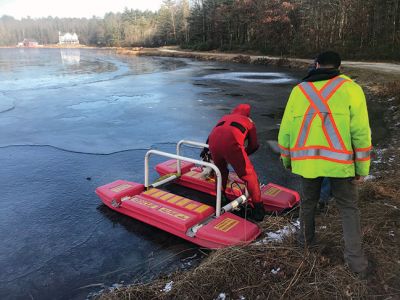 Murphy the dog
Firefighters in Rochester rescued Murphy the dog from the icy waters off of Sarah Sherman Road after straying from his family and falling through the thin ice on December 20. Firefighter Jeff Eldridge mounted an ice sled and headed 300 feet across the frozen pond to reach Murphy. The two were then pulled to land and Murphy was promptly taken to the ambulance. Pictured here, Murphy is warmed up by RFD Paramedic Jon Villa. Photo courtesy of the Rochester Fire Department
