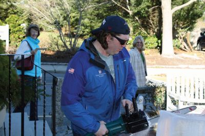 Ice Sculpture at the Marion Art Center
In front of the Marion Art Center, Tim Wade carved out an ice sculpture of a train on December 13, an unseasonably warm December day. The MAC reported several phone calls concerning the heat and whether the event would be canceled. Wade made his icy creation despite the warmth, as he has done for 10 years. Photos by Jean Perry
