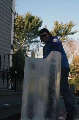 Ice Sculpture at the Marion Art Center
In front of the Marion Art Center, Tim Wade carved out an ice sculpture of a train on December 13, an unseasonably warm December day. The MAC reported several phone calls concerning the heat and whether the event would be canceled. Wade made his icy creation despite the warmth, as he has done for 10 years. Photos by Jean Perry
