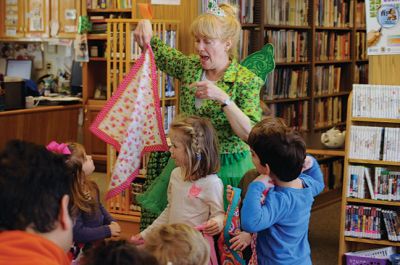 Irish Fairy Godmother
Bringing with her a magical teapot, the Irish Fairy Godmother visited the Joseph H. Plumb Memorial Library March 7, treating about 25 kids to a magic show. Magician Debbie O’Carroll said her favorite part about being the Irish Fairy Godmother is seeing the cheerful responses from her young audience. Photos by Felix Perez
