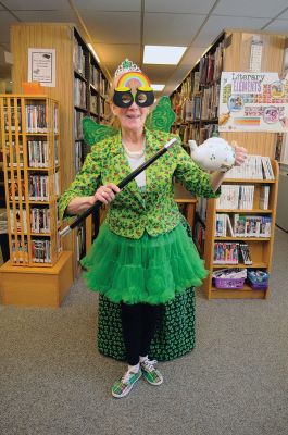 Irish Fairy Godmother
Bringing with her a magical teapot, the Irish Fairy Godmother visited the Joseph H. Plumb Memorial Library March 7, treating about 25 kids to a magic show. Magician Debbie O’Carroll said her favorite part about being the Irish Fairy Godmother is seeing the cheerful responses from her young audience. Photos by Felix Perez
