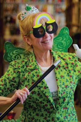 Irish Fairy Godmother
Bringing with her a magical teapot, the Irish Fairy Godmother visited the Joseph H. Plumb Memorial Library March 7, treating about 25 kids to a magic show. Magician Debbie O’Carroll said her favorite part about being the Irish Fairy Godmother is seeing the cheerful responses from her young audience. Photos by Felix Perez
