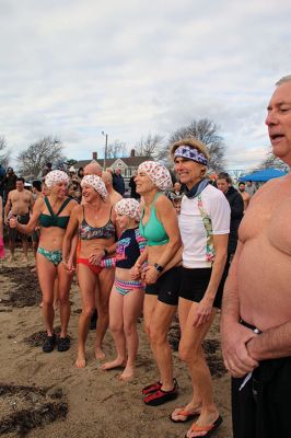 Keep on Plungin’ 
The annual Keep on Plungin’ New Year’s Day swim drew well over 100 participants to Mattapoisett Town Beach, continuing a tradition started in 2013 by Will and Michelle Huggins to help families facing expenses related to cancer care. In the last two years, the community-driven effort has benefitted three families and Dana Farber with a $1,000 donation in Huggins’ honor. This year, organizers anticipate supporting at least two more families with checks for $2,000. Photos by Mick Colageo
