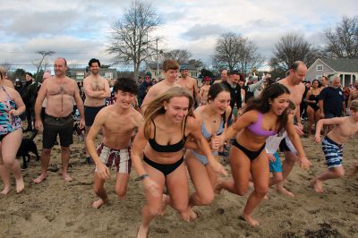 Keep on Plungin’ 
The annual Keep on Plungin’ New Year’s Day swim drew well over 100 participants to Mattapoisett Town Beach, continuing a tradition started in 2013 by Will and Michelle Huggins to help families facing expenses related to cancer care. In the last two years, the community-driven effort has benefitted three families and Dana Farber with a $1,000 donation in Huggins’ honor. This year, organizers anticipate supporting at least two more families with checks for $2,000. Photos by Mick Colageo
