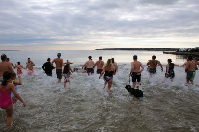 Keep on Plungin’ 
The annual Keep on Plungin’ New Year’s Day swim drew well over 100 participants to Mattapoisett Town Beach, continuing a tradition started in 2013 by Will and Michelle Huggins to help families facing expenses related to cancer care. In the last two years, the community-driven effort has benefitted three families and Dana Farber with a $1,000 donation in Huggins’ honor. This year, organizers anticipate supporting at least two more families with checks for $2,000. Photos by Mick Colageo
