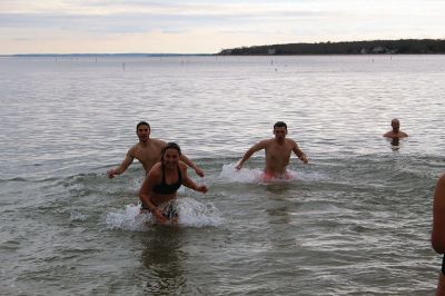 Keep on Plungin’ 
The annual Keep on Plungin’ New Year’s Day swim drew well over 100 participants to Mattapoisett Town Beach, continuing a tradition started in 2013 by Will and Michelle Huggins to help families facing expenses related to cancer care. In the last two years, the community-driven effort has benefitted three families and Dana Farber with a $1,000 donation in Huggins’ honor. This year, organizers anticipate supporting at least two more families with checks for $2,000. Photos by Mick Colageo
