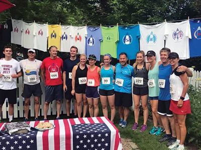 Mattapoisett Road Race
For years, the Kassabian family has inspired competitors in the Mattapoisett 5 Mile Road Race by hanging official race T-shirts of the past in front of their Church Street home along the racecourse. Courtesy of Laurie Kassabian
