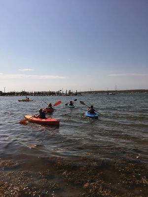 Kayak Clinic
August 9 and 10, the Mattapoisett Land Trust in partnership with the Mattapoisett Recreation Department held two kayak clinics for children ages 8 to 12. MLT volunteers provided safety instructions, a major focus of the program. Kayak introductory instruction has been provided by the two organizations for six years. This year local photographer and author Donna Lee Tufts greeted the children at the end of the program, sharing her thoughts of the joy of kayaking and presenting each child with a copy of her b
