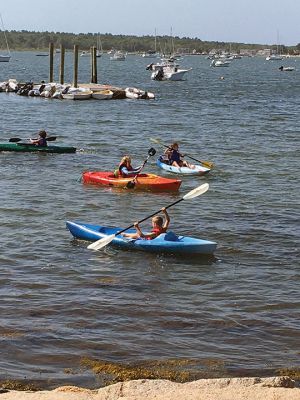 Kayak Clinic
August 9 and 10, the Mattapoisett Land Trust in partnership with the Mattapoisett Recreation Department held two kayak clinics for children ages 8 to 12. MLT volunteers provided safety instructions, a major focus of the program. Kayak introductory instruction has been provided by the two organizations for six years. This year local photographer and author Donna Lee Tufts greeted the children at the end of the program, sharing her thoughts of the joy of kayaking and presenting each child with a copy of her b
