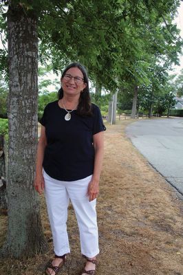 Keel Award
Sandy Hering, the 2022 Keel Award recipient for the Town of Mattapoisett, credits the Tree Committee membership for its effort and expertise in advocating for trees like the ones lining Water Street behind her. Photo by Mick Colageo
