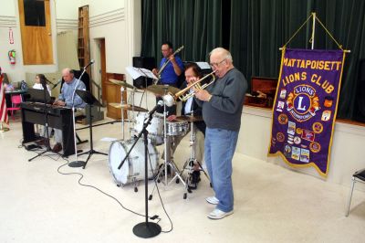 Lion's Dinner
The Mattapoisett Lions Club, with help from Mattapoisett Boy Scout Troup 53, welcomed about one hundred seniors to Mattapoisett Congregation Church's Reynard Hall for a special afternoon dinner on Saturday April, 18. The Lions Club served a hot turkey supper with all of the trimmings and also provided musical entertainment for the diners listening pleasure. Photo by Robert Chiarito
