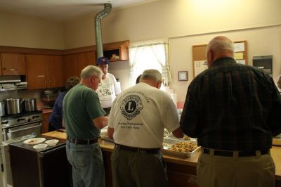 Lion's Dinner
The Mattapoisett Lions Club, with help from Mattapoisett Boy Scout Troup 53, welcomed about one hundred seniors to Mattapoisett Congregation Church's Reynard Hall for a special afternoon dinner on Saturday April, 18. The Lions Club served a hot turkey supper with all of the trimmings and also provided musical entertainment for the diners listening pleasure. Photo by Robert Chiarito
