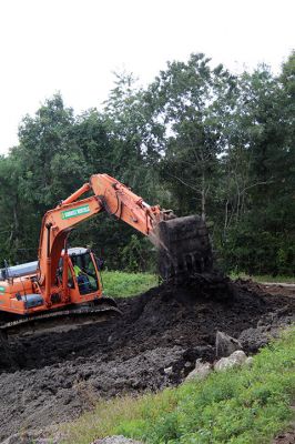 Benson Brook Road
A truck is loaded to haul away the last of the sludge from the lagoon at Marion's wastewater treatment plant on Benson Brook Road on Monday morning. The operation, overseen by Methuen Construction, is expected to be completed this week, paving the way for the grading and relining of the lagoon by the end of October. Photos by Mick Colageo
