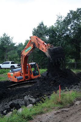 Benson Brook Road
A truck is loaded to haul away the last of the sludge from the lagoon at Marion's wastewater treatment plant on Benson Brook Road on Monday morning. The operation, overseen by Methuen Construction, is expected to be completed this week, paving the way for the grading and relining of the lagoon by the end of October. Photos by Mick Colageo
