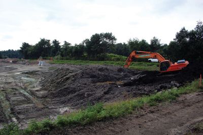 Benson Brook Road
A truck is loaded to haul away the last of the sludge from the lagoon at Marion's wastewater treatment plant on Benson Brook Road on Monday morning. The operation, overseen by Methuen Construction, is expected to be completed this week, paving the way for the grading and relining of the lagoon by the end of October. Photos by Mick Colageo
