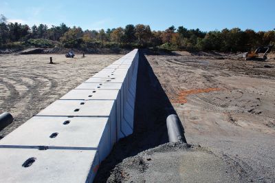 Marion Lagoon
The forebay wall is in place at Marion's Wastewater Treatment Plant lagoon. Solids will be processed to the northwest side of the concrete wall, right, and liquids in the larger area of the lagoon on the southeast side, according to DPW Director Nathaniel Munafo. A liner made up of over 30 pieces is on site awaiting final surface grading by Methuen Construction and the installation of a Multiflo infrastructural piping system. 
