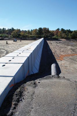 Marion Lagoon
The forebay wall is in place at Marion's Wastewater Treatment Plant lagoon. Solids will be processed to the northwest side of the concrete wall, right, and liquids in the larger area of the lagoon on the southeast side, according to DPW Director Nathaniel Munafo. A liner made up of over 30 pieces is on site awaiting final surface grading by Methuen Construction and the installation of a Multiflo infrastructural piping system. 
