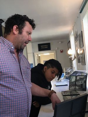 Mattapoisett Museum
Mattapoisett Museum curator Connor Gaudet and museum volunteer Mars Castro discuss objects from the Then and Now exhibit now on display through the fall season. The exhibit includes objects, printed materials, old photos and various types of ephemera from the museum’s extensive collection. Photos by Marilou Newell
