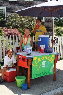 Lemonade!
It was another scorching Harbor Days this past weekend when the Mattapoisett Lions hosted the annual event under clear skies and hot sun on July 16 and 17. Visitors milled around, enjoying the wares, lemonade, strawberry shortcake, music and more. Photos by Anne Kakley and Felix Perez. July 21, 2011 edition
