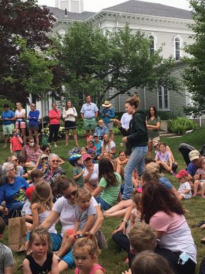 Library Zoo
Lauren Paine of Pine Meadows Farm located in Mattapoisett, along with her father, Jeff, brought members of their “herd” to the Elizabeth Taber Library in Marion on July 8. Well over 100 people of all ages enjoyed the opportunity to visit with and learn about exotic animals. The younger members of the crowd listened intently as they heard about the eating habits and habitats of bearded dragons, Nigerian goats, lop-eared rabbits, tortoises, and alpacas, for which the farm is known. Photos by Marilou Newell
