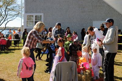 Family Fun Festival 
Families came out in record numbers to enjoy the 4th Annual Fall Free Family Fun Festival sponsored by the Mattapoisett’s Lion Club on October 19 held at Shipyard Park. Bruce Rocha of the club estimated attendance at over 400. Kids and adults alike enjoyed free face painting, bowling with pumpkins, a corn hole toss, snacks, hayrides to Ned’s Point and, yes, free pumpkins to take home. Photos by Marilou Newell and Sandra Frechette
