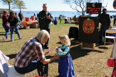 Family Fun Festival 
Families came out in record numbers to enjoy the 4th Annual Fall Free Family Fun Festival sponsored by the Mattapoisett’s Lion Club on October 19 held at Shipyard Park. Bruce Rocha of the club estimated attendance at over 400. Kids and adults alike enjoyed free face painting, bowling with pumpkins, a corn hole toss, snacks, hayrides to Ned’s Point and, yes, free pumpkins to take home. Photos by Marilou Newell and Sandra Frechette
