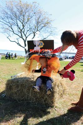 Family Fun Festival 
Families came out in record numbers to enjoy the 4th Annual Fall Free Family Fun Festival sponsored by the Mattapoisett’s Lion Club on October 19 held at Shipyard Park. Bruce Rocha of the club estimated attendance at over 400. Kids and adults alike enjoyed free face painting, bowling with pumpkins, a corn hole toss, snacks, hayrides to Ned’s Point and, yes, free pumpkins to take home. Photos by Marilou Newell and Sandra Frechette
