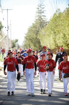 Old Rochester Little League
The Old Rochester Little League celebrated its Opening Day of the 2016 season on Saturday, April 30 at Gifford Park off Dexter Road in Rochester. The young athletes took part in the traditional Opening Day parade, which began at Dexter Park and concluded at Dexter Field. The players then circled the field for the National Anthem, with a flyover by Glenn Lawrence in his plane. After opening ceremonies, the first games of the season were held. Photo by Colin Veitch
