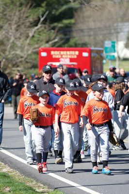 Old Rochester Little League
The Old Rochester Little League celebrated its Opening Day of the 2016 season on Saturday, April 30 at Gifford Park off Dexter Road in Rochester. The young athletes took part in the traditional Opening Day parade, which began at Dexter Park and concluded at Dexter Field. The players then circled the field for the National Anthem, with a flyover by Glenn Lawrence in his plane. After opening ceremonies, the first games of the season were held. Photo by Colin Veitch
