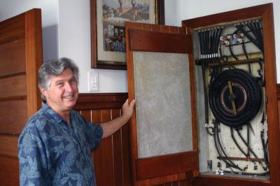 Masonic Anniversary
Pythagorean Lodge Master Tom Dexter shows how a 100-year-old electrical system still manages to provide light for the Pythagorean Lodge hall, located on Spring Street in Marion. Photo by Joan Hartnett-Barry.
