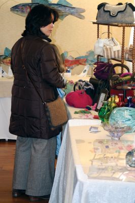 Art Center Shopping
Shoppers got the chance to choose from unique pieces of artwork at the 2009 Marion Art Center Holiday Shop. Work from area artists included woodcarvings, paintings, fiber-arts, glass, and more. Photo by Anne OBrien-Kakley.
