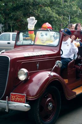 Sparky Speaks
Sparky, the Spokesdog for fire safety, waves to onlookers as he rides an antique fire engine at the 2009 Marion Fire Department Open House. Firefighters from the department served coffee, a hot breakfast, and allowed area residents to tour the facilities on the morning of October 10. Children enjoyed climbing on the engines and all the donuts they could eat. Photo by Anne OBrien-Kakley. October 15, 2009 edition
