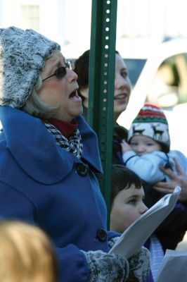 MHS Caroling
The Mattapoisett Historical Society hosted a caroling event on Sunday, December 11, 2011. About 25 people gathered at the Museum and Carriage House at 5 Church Street and then meandered throughout the village to spread Holiday cheer. A caroling favorite for the children was Rudolph the Red Nosed Reindeer and Frosty the Snowman – adult carolers preferred "We Wish You a Merry Christmas". Photo by Anne Kakley.
