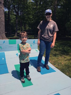 On view now as an outdoor art installation are two works created by UMass visual art students located at Dunseith, the Mattapoisett Land Trust park property at the corner of Route 6 and North Street. Both works are interactive in that The Bean has moveable parts that give viewers of all ages the opportunity to leave their own impact on tiny sculptures by relocating them across the surface of the sculpture. The Catalyst is bed-like, beckoning viewers to set aside cares and rest for a moment. 
