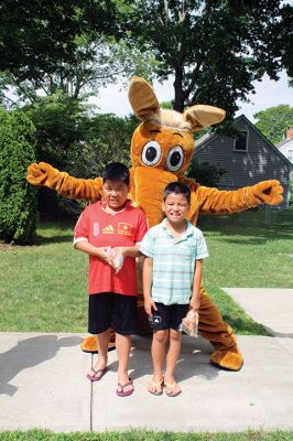 Friends of the Mattapoisett Library
The Friends of the Mattapoisett Library held its annual book sale during the Harbor Days week. The Aardvark popped in on Thursday, July 14, to buy some books and pass out squeaky aardvarks to the kids. Photos by Jean Perry
