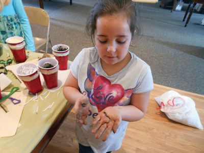 Marion Natural History Museum’s “Composting”
Investigating what makes a healthy soil during the Marion Natural History Museum’s “Composting” afterschool program.  The students took a look at some of the animals that help to break down compost and built a mini-composter to bring home. Photo courtesy Elizabeth Leidhold
