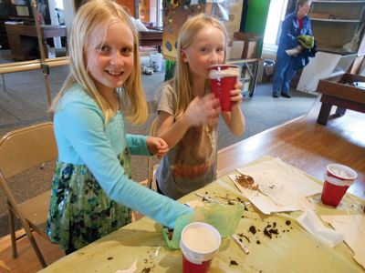 Marion Natural History Museum’s “Composting”
Investigating what makes a healthy soil during the Marion Natural History Museum’s “Composting” afterschool program.  The students took a look at some of the animals that help to break down compost and built a mini-composter to bring home. Photo courtesy Elizabeth Leidhold
