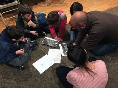 Marion Natural History Museum
On November 28, the Marion Natural History Museum's afterschool group hosted Manny da Costa, a watershed scientist from Inter-fluve. Da Costa discussed some river restoration projects and taught about the importance of rivers for fish passage and water quality for our watershed.  Student groups worked on problems involving hydrology, fish passage, riparian (rivers), and shellfish, and came up with some great ideas for protecting our watershed. 
