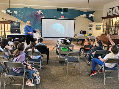 Marion Natural History Museum
On March 13, the Marion Natural History Museum's afterschool group enjoyed hearing about planets, stars, galaxies and the universe with amateur astronomer Peter Marshall. Peter specializes in studying and taking photos of these rarely seen objects from his home in Rochester, and the kids were happy to share their astronomical insights with the group. Peter also shared incredible photos from NASA's spacecrafts, Voyagers 1 and 2. The students were then invited to create their own planets with the knowledge th
