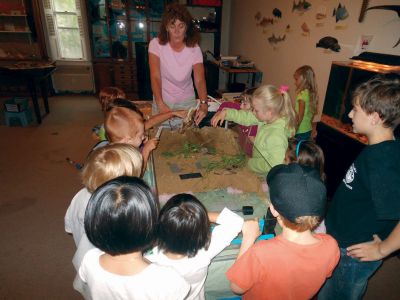 Healthy Watershed
 The Marion Natural History museum after school program learned about what makes a healthy watershed and then tried their hand at designing their own. Photo by Elizabeth Liedhold
