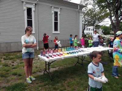 Chemistry of Tie Dye
The Marion Natural History Museum's last afterschool program of this school year featured "Chemistry of Tie Dye" with Chemist Jessica Robidoux and coordinated by Dr. William (Toby) Dills of UMass Dartmouth's Chemistry Department.  The Museum wishes to thank Ms. Robidoux, Dr. Dills, and all the many volunteers who showed up to help with the program. The students learned a little something about acids and bases as well as having fun dyeing their shirts.  Photo courtesy Elizabeth Leidhold
