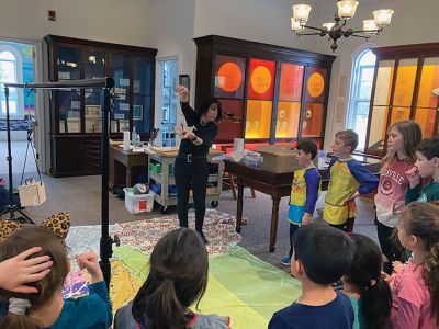 Marion Museum of Natural History
The Marion Museum of Natural History would like to thank Karen Alves Cronin and our volunteer parents for the wonderful program March 15. First, Karen showed us how gravity and a simple bucket suspended on a line and filled with paint can produce beautiful paintings. The students painted their canvases with a colorful background and then placed them under the suspended bucket pendulum. When filled with paint and rotated over the canvases.
