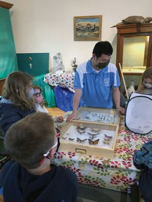 Marion Natural History Museum
The Marion Natural History Museum afterschool group had a wonderful time learning about “Amazing Arthropods” with entomologist Blake Dinius of Plymouth County Extension Service. Members of the group were able to handle a couple of beautiful Io moths, which as caterpillars feed on maple leaves. The adult moths emerge with no mouths and only live in this stage for one to two weeks.  Photos courtesy Elizabeth Leidhold
